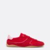 Flache Sneaker mit Details aus Leder
