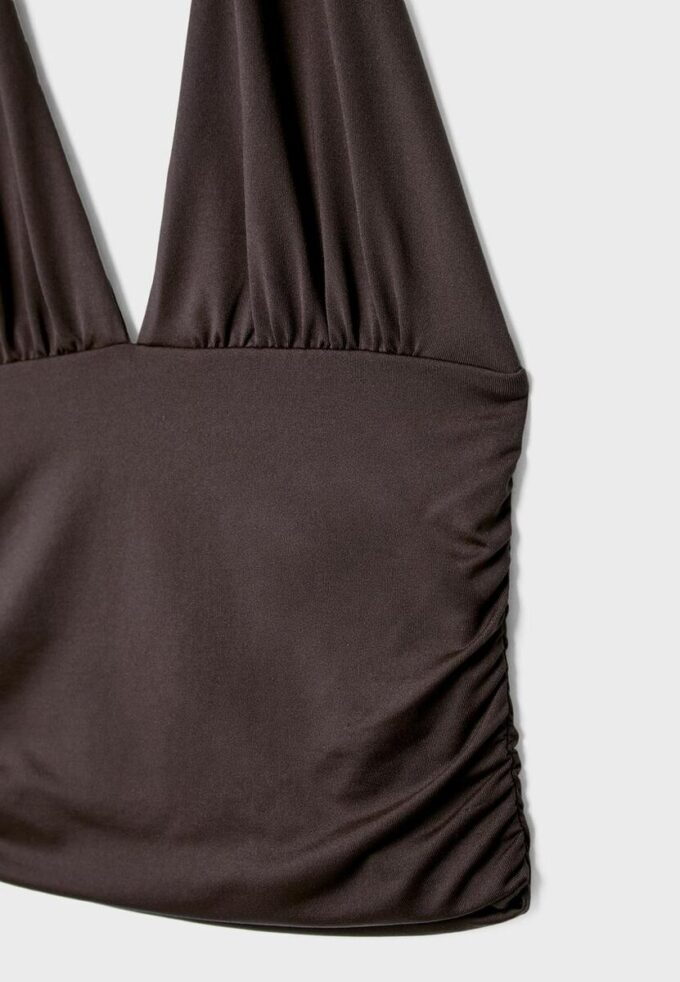 Halter-Oberteil mit gerafftem Bindeband am Hals Halter-Oberteil mit gerafftem Bindeband am Hals