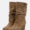 Stiefel mit Keilschuhen aus Leder Stiefel mit Keilschuhen aus Leder