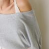 Strickpullover mit U-Boot-Ausschnitt und Überlagerung Strickpullover mit U-Boot-Ausschnitt und Überlagerung